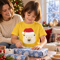 Thumbnail for Santa Polar Bear Christmas kids t shirt in Daisy, worn in a Christmas home setting with the Santa polar bear front print visible.