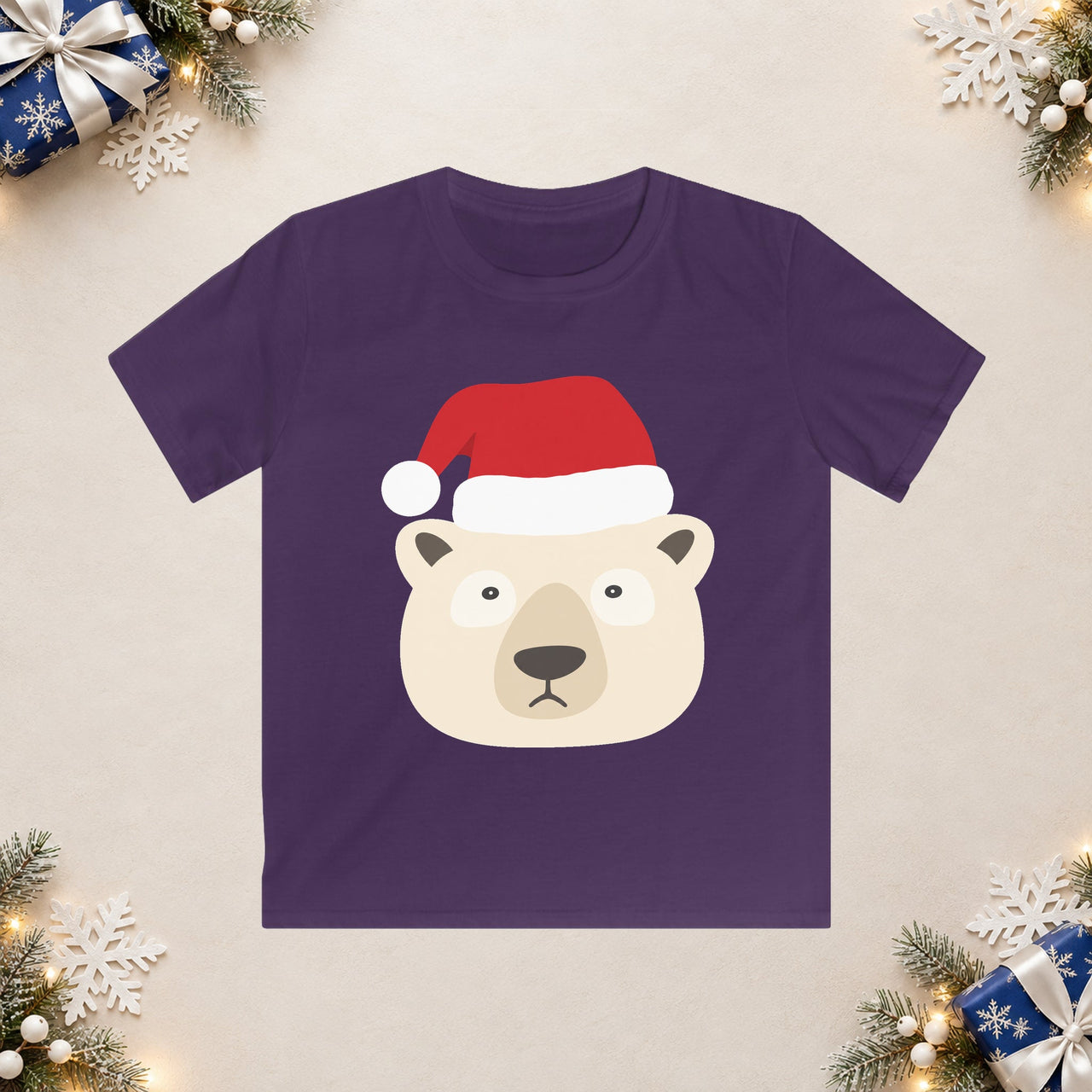 Santa polar bear Christmas kids t shirt in Purple, front view with the Santa animal illustration on a Christmas flat-lay background.