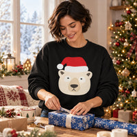Thumbnail for Santa Polar Bear Christmas sweatshirt in Black, worn in a Christmas home setting with the Santa polar bear front print visible.