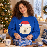 Thumbnail for Santa Polar Bear Christmas sweatshirt in Royal, worn in a Christmas home setting with the Santa polar bear front print visible.