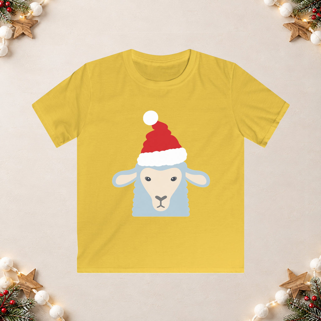 Santa sheep Christmas kids t shirt in Daisy, front view with the Santa animal illustration on a Christmas flat-lay background.