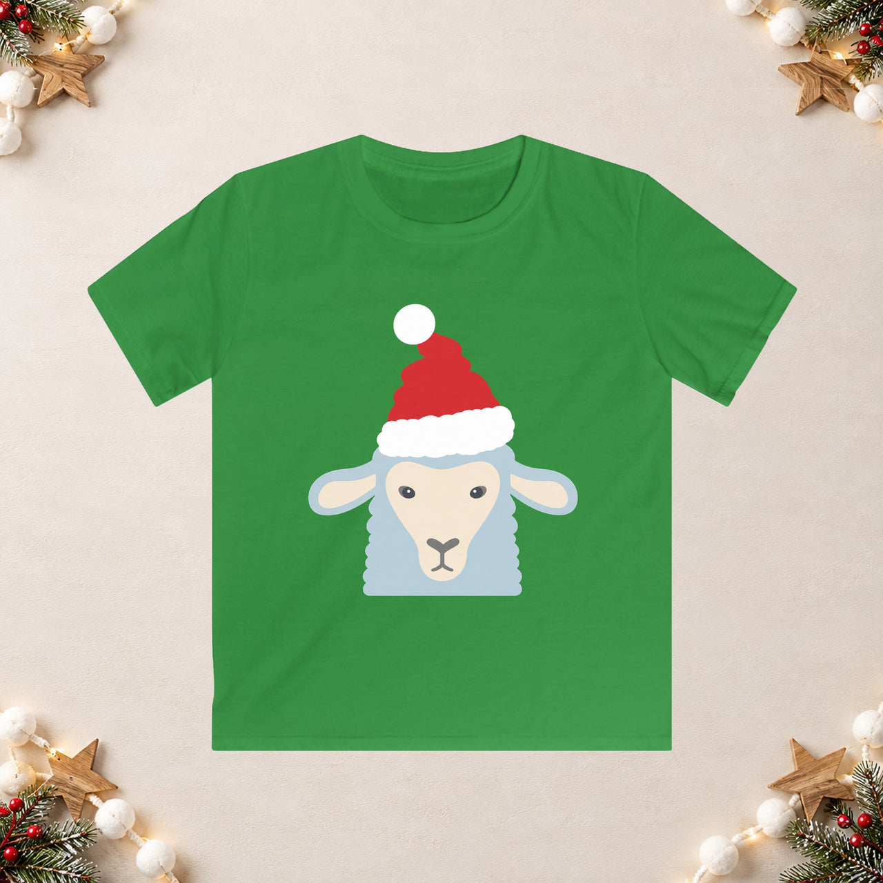 Santa sheep Christmas kids t shirt in Irish Green, front view with the Santa animal illustration on a Christmas flat-lay background.