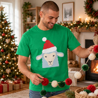 Thumbnail for Santa Sheep Christmas Unisex T-Shirt in Irish Green, worn in a Christmas home setting with the Santa sheep front print visible.