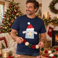 Thumbnail for Santa Sheep Christmas Unisex T-Shirt in Navy, worn in a Christmas home setting with the Santa sheep front print visible.