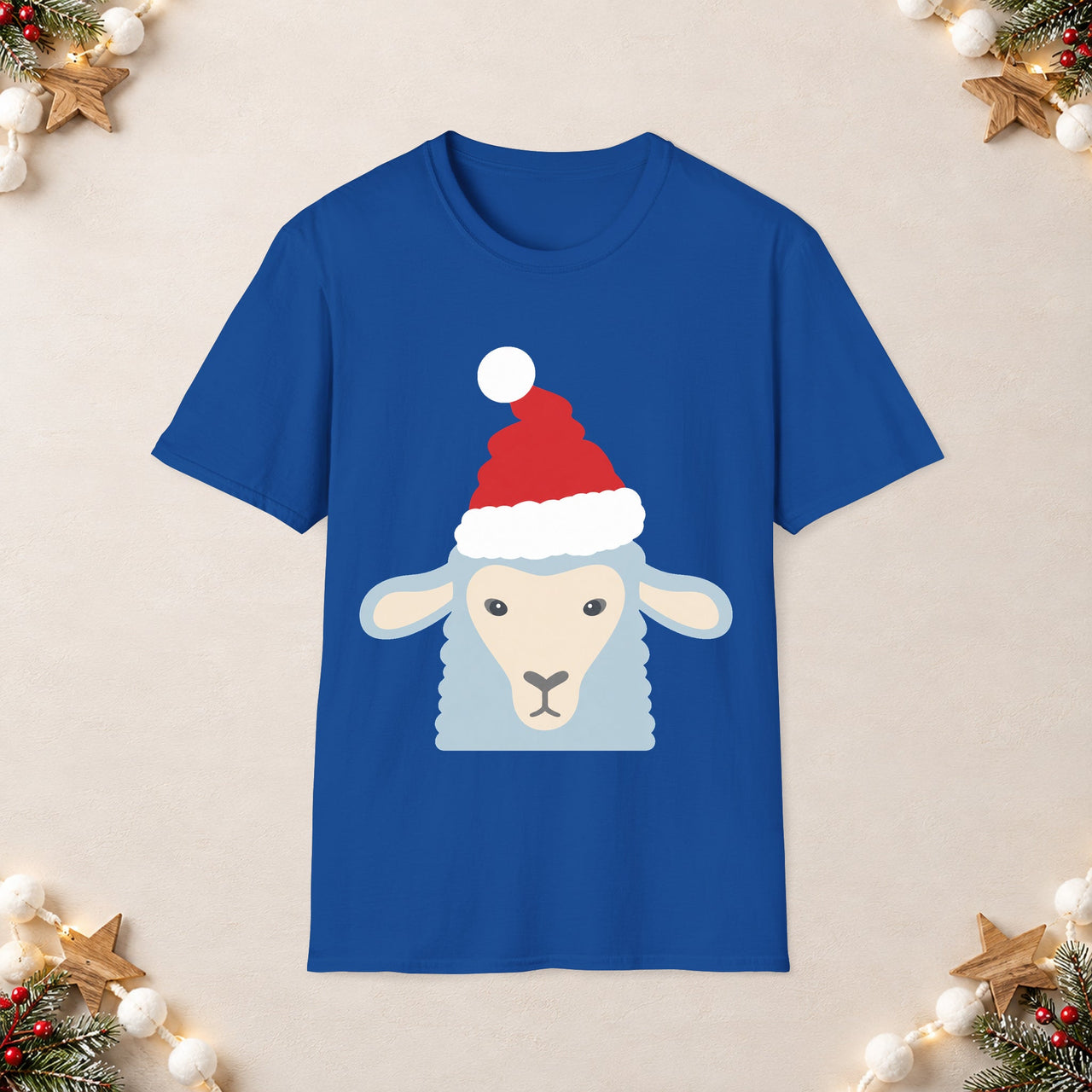Santa sheep Christmas unisex t shirt in Royal, front view with the Santa animal illustration on a Christmas flat-lay background.