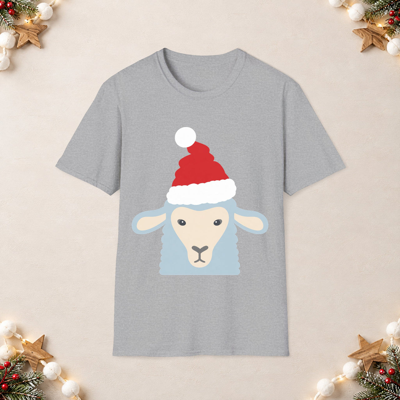 Santa sheep Christmas unisex t shirt in Sport Grey, front view with the Santa animal illustration on a Christmas flat-lay background.