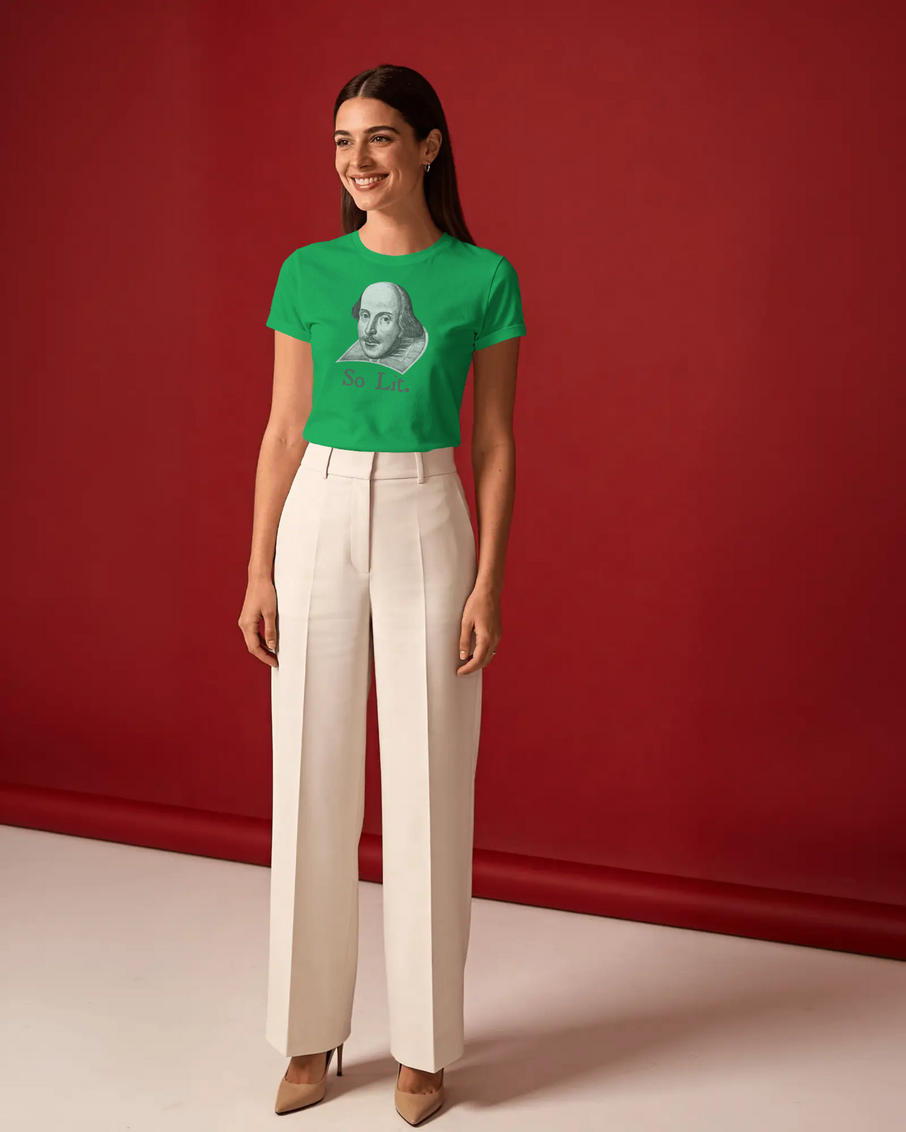 Shakespeare So Lit women’s fitted t-shirt in Irish Green, worn by a model against a red studio backdrop